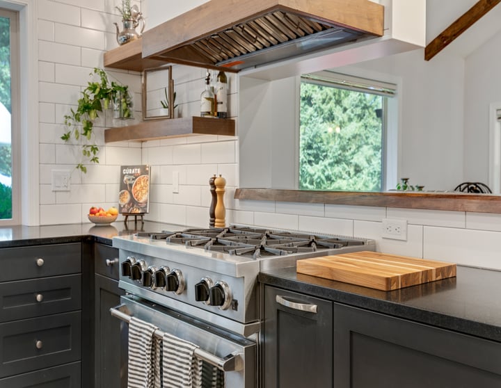 remodeled kitchen stainless steel oven and black countertops by Corvallis Custom Kitchens & Baths in Corvallis, Oregon