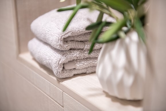 close up of bath towels and plant in remodeled bathroom by corvallis custom kitchens and baths in corvallis oregon