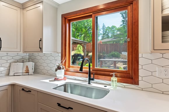 white countertops with black sink in remodeled kitchen by corvallis custom kitchens and baths in corvallis oregon