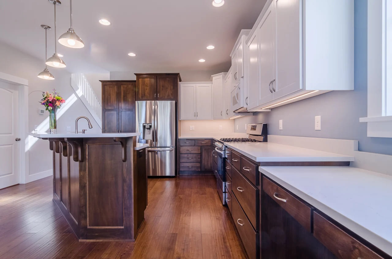kitchen with dark brown wood cabinets and white countertops by corvallis kitchens and bathrooms kitchen with dark brown wood cabinets and white countertops by corvallis kitchens and bathrooms