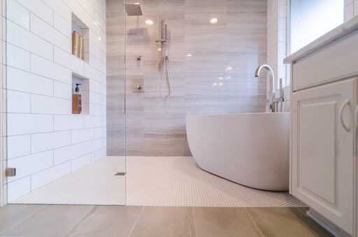 tan luxury bathroom with white soaking tub by corvallis kitchen and bathroom in oregon