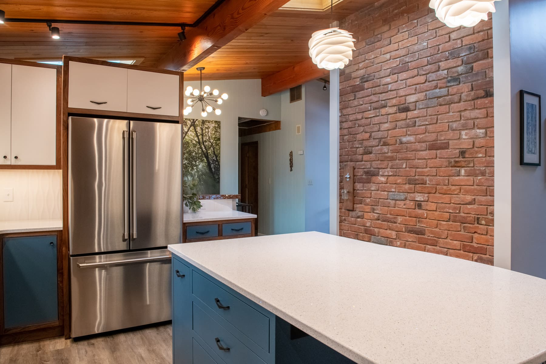 white island with fridge and brick wall in kitchen remodel by Corvallis Custom Kitchen and Baths in Corvallis, Oregon white island with fridge and brick wall in kitchen remodel by Corvallis Custom Kitchen and Baths in Corvallis, Oregon