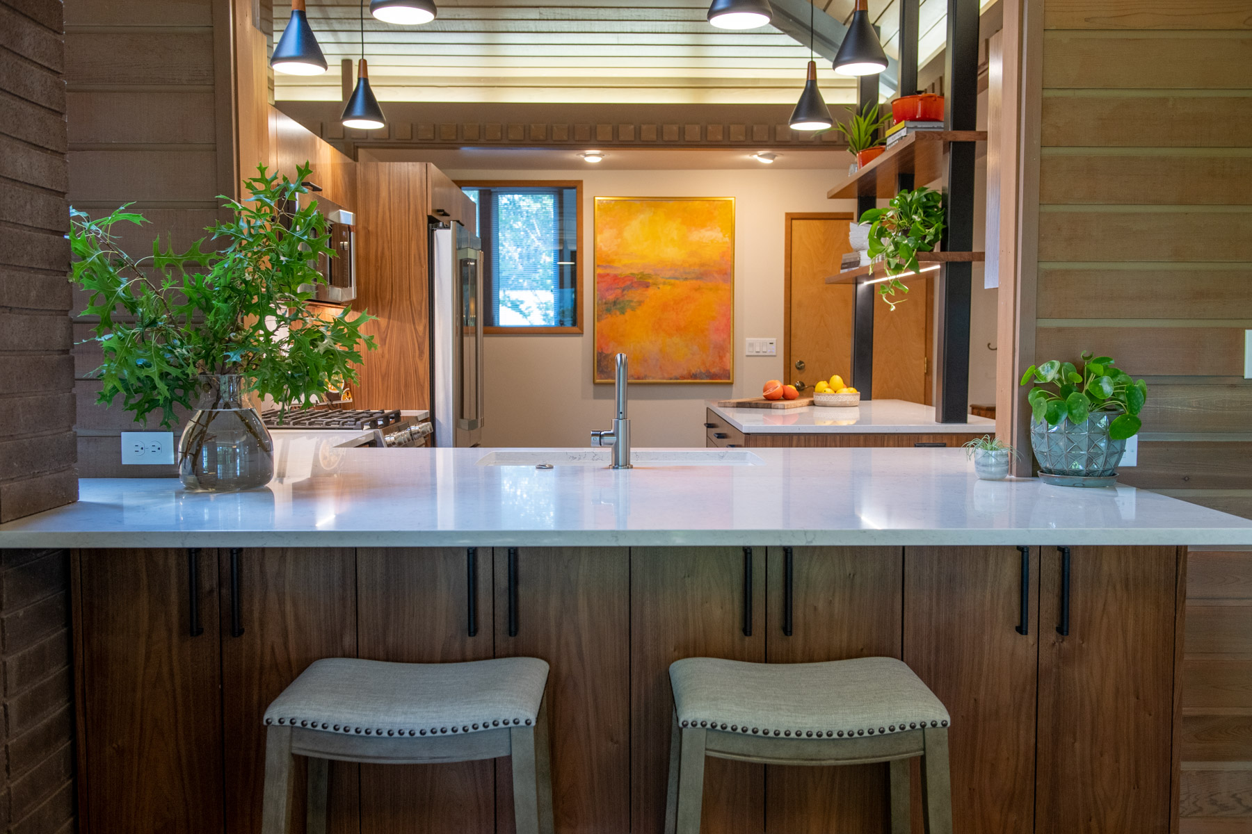 brown wooden rustic kitchen with bar stools by CCKB in Corvallis Oregon